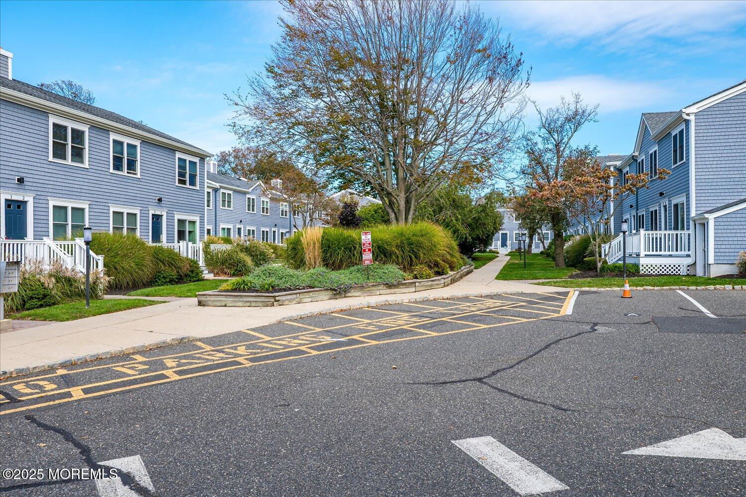 a view of road with yard and trees