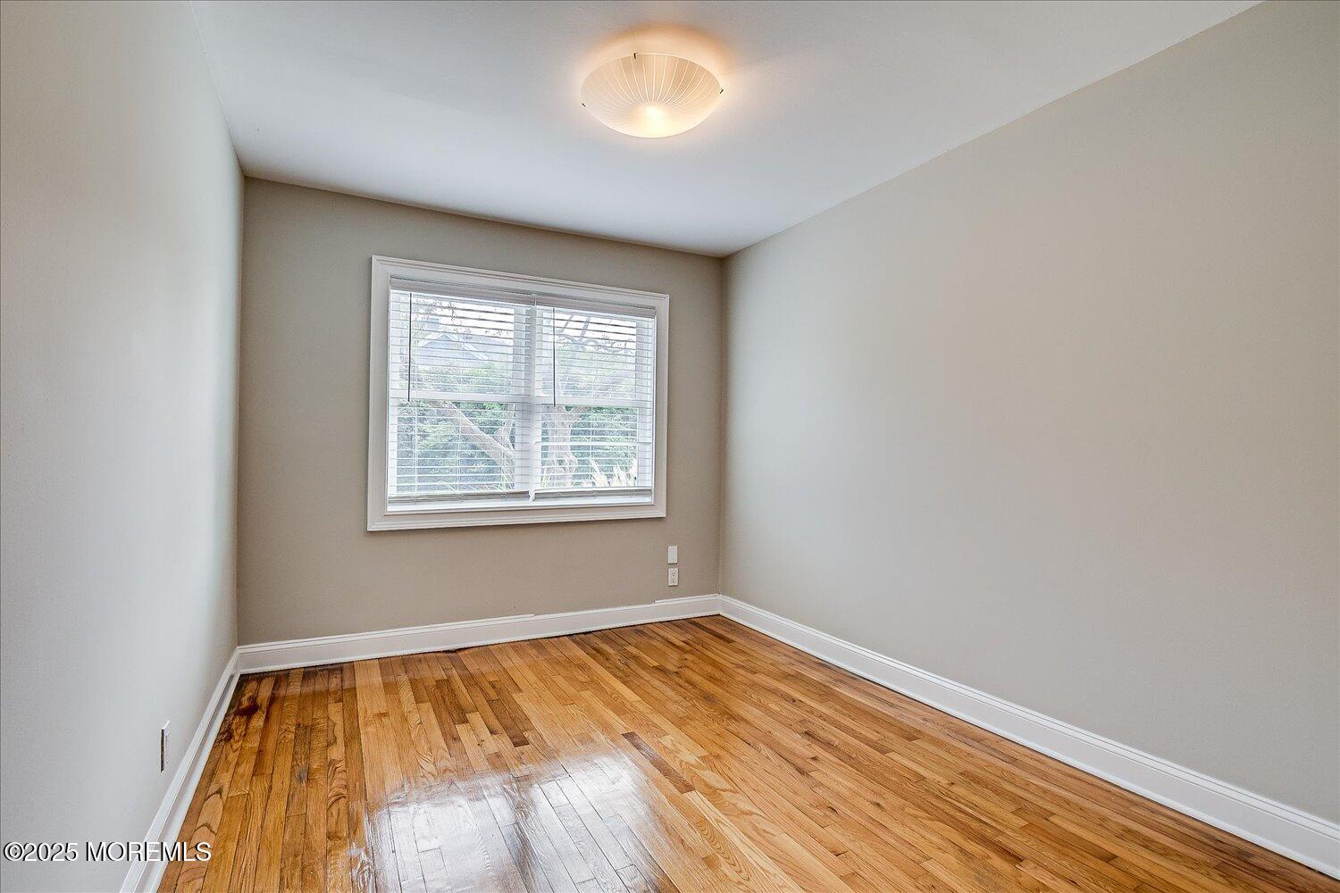 31 Cedar Avenue, Unit 11 Long Branch, NJ 07740 - Photo 17 of 19 an empty room with a window
