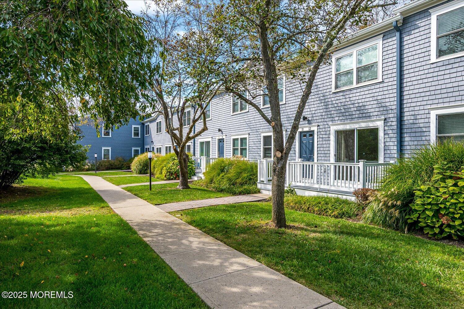 31 Cedar Avenue, Unit 11 Long Branch, NJ 07740 - Photo 2 of 19 a view of a house with a yard and tree s