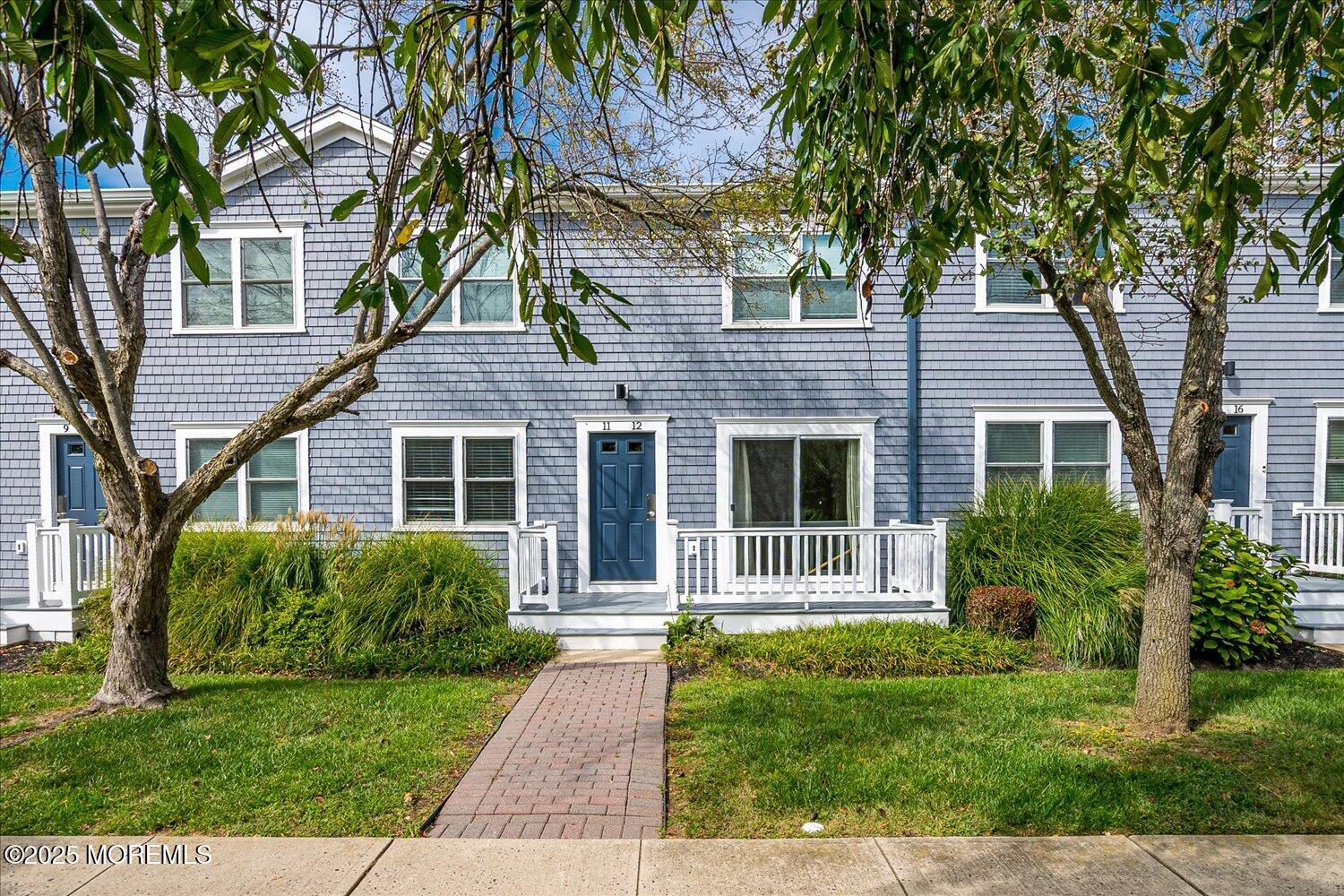 31 Cedar Avenue, Unit 11 Long Branch, NJ 07740 - Photo 3 of 19 front view of a house with a yard