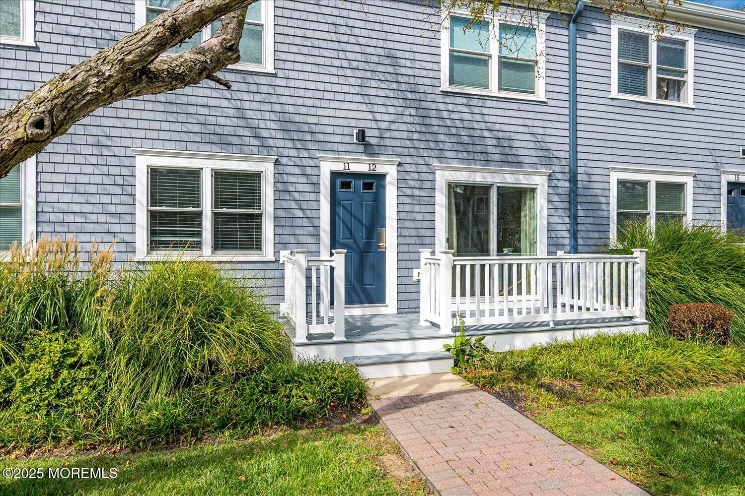 31 Cedar Avenue, Unit 11 Long Branch, NJ 07740 - Photo 4 of 19 a front view of a house with a yard