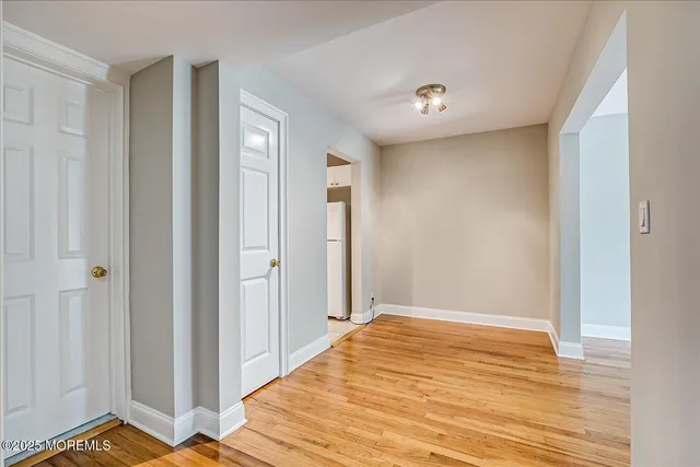 a view of a livingroom with wooden floor