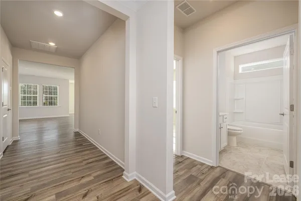 a view of an empty room and glass door