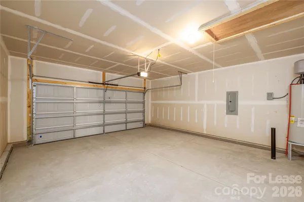 a view of house with backyard