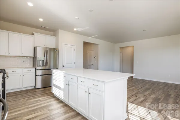 a kitchen with a refrigerator a sink and dishwasher