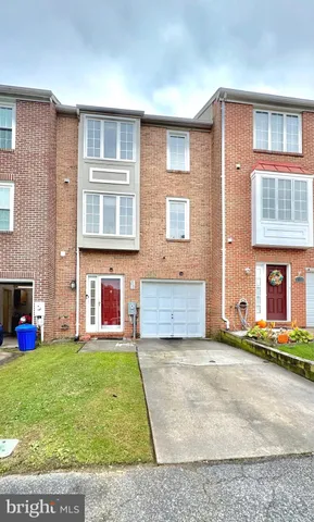 a view of an apartment with a garden