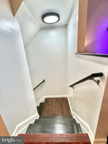 a view of staircase with a rug