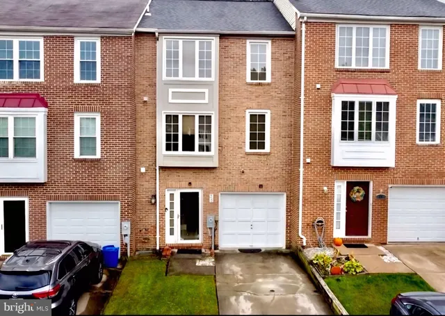 a view of a brick building with many windows