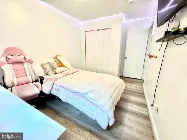 a bedroom with a bed and a mirror