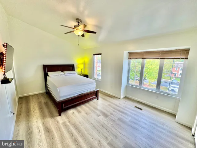a bedroom with a bed and window