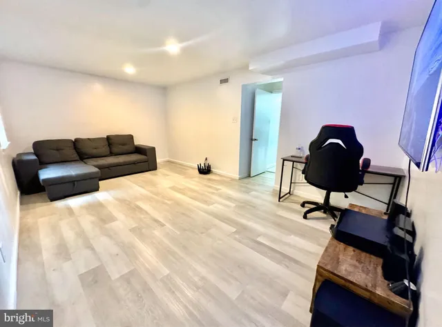 a living room with furniture and a rug