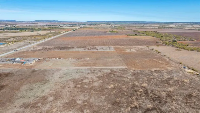 a view of a large body of water and mountain in a city