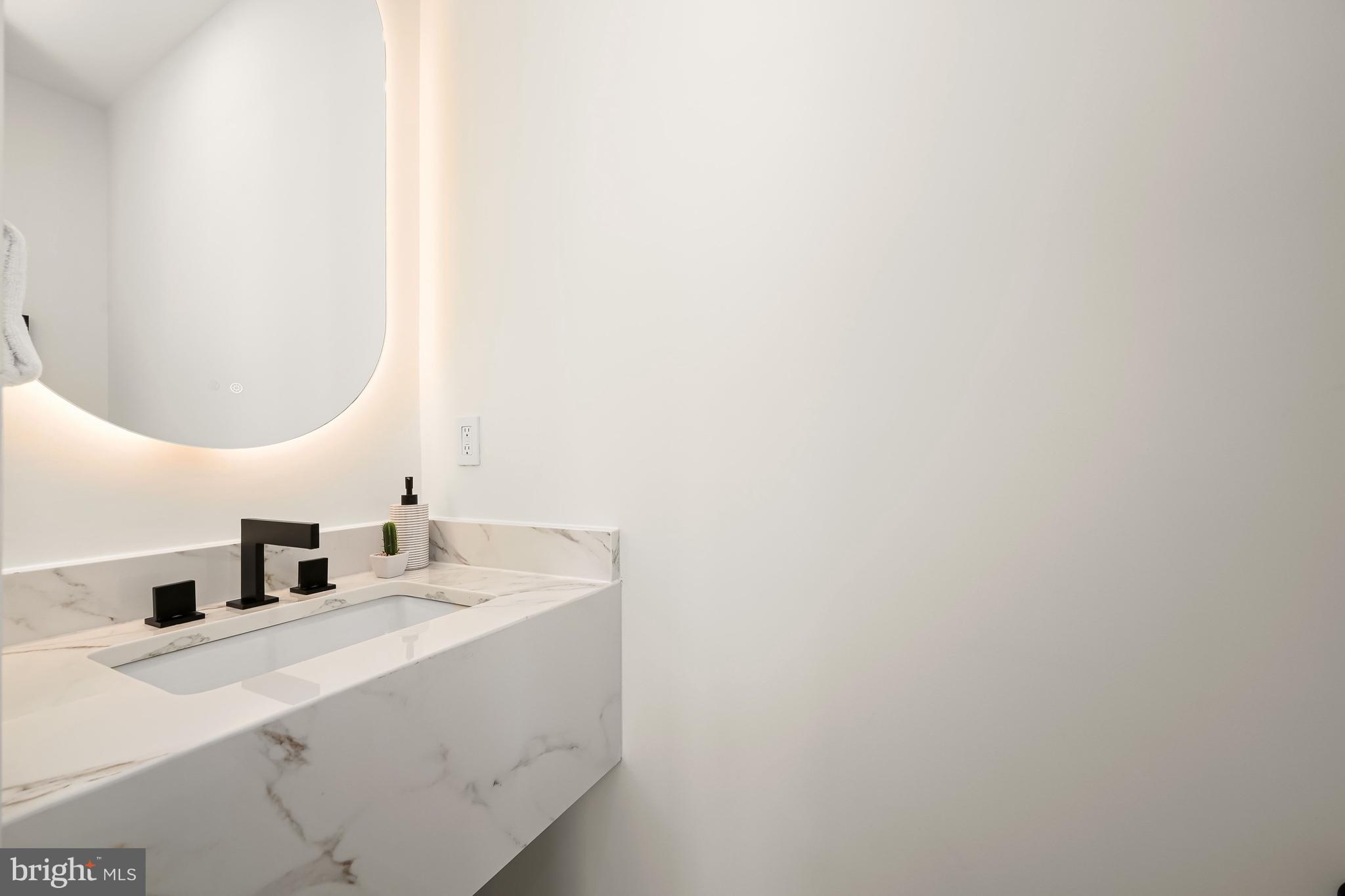 3554 T Street Northwest Washington, DC 20007 - Photo 18 of 54 Main level powder room with custom faucet design