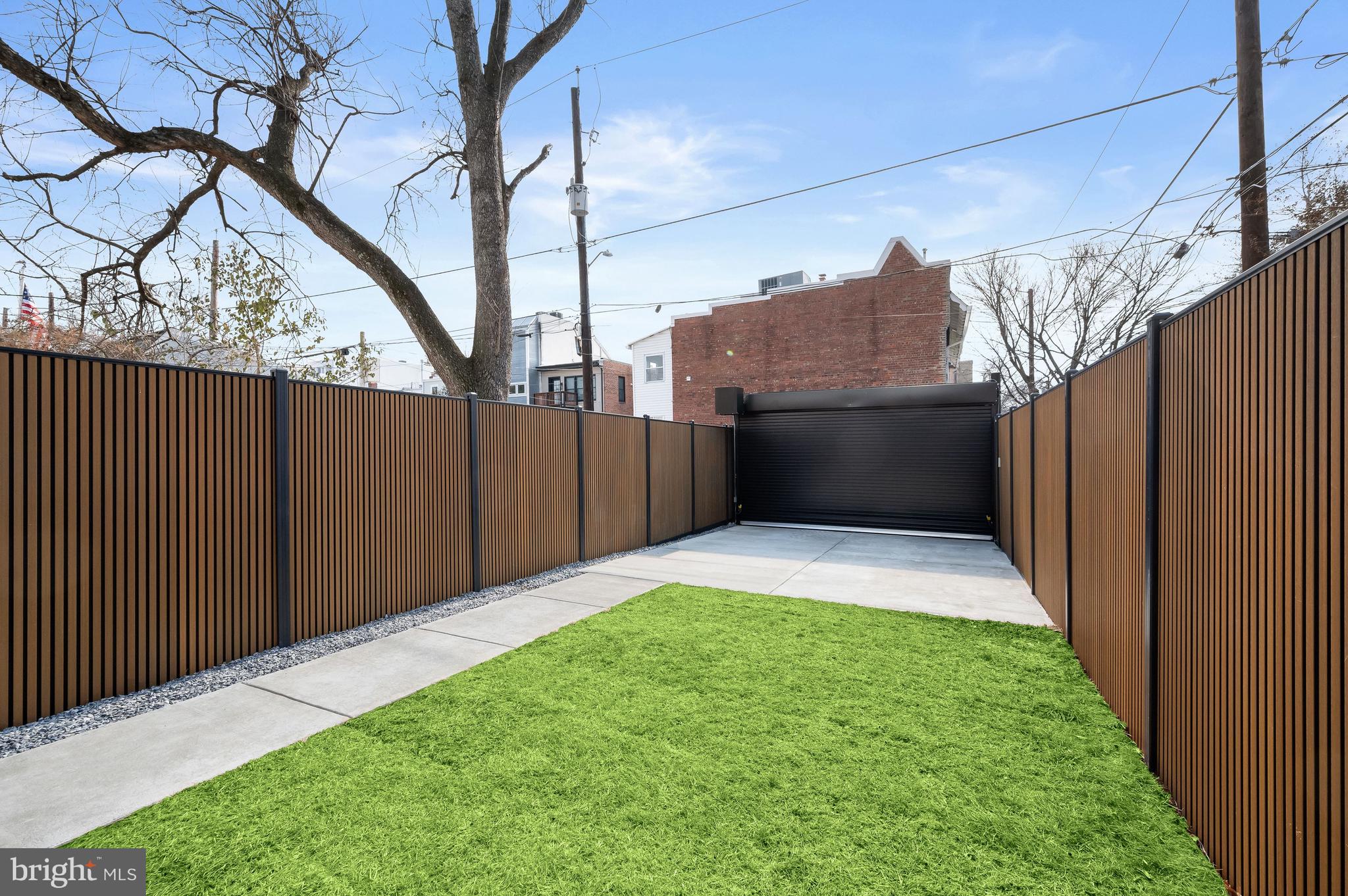 3554 T Street Northwest Washington, DC 20007 - Photo 52 of 54 Rear lawn with 2-car motor court