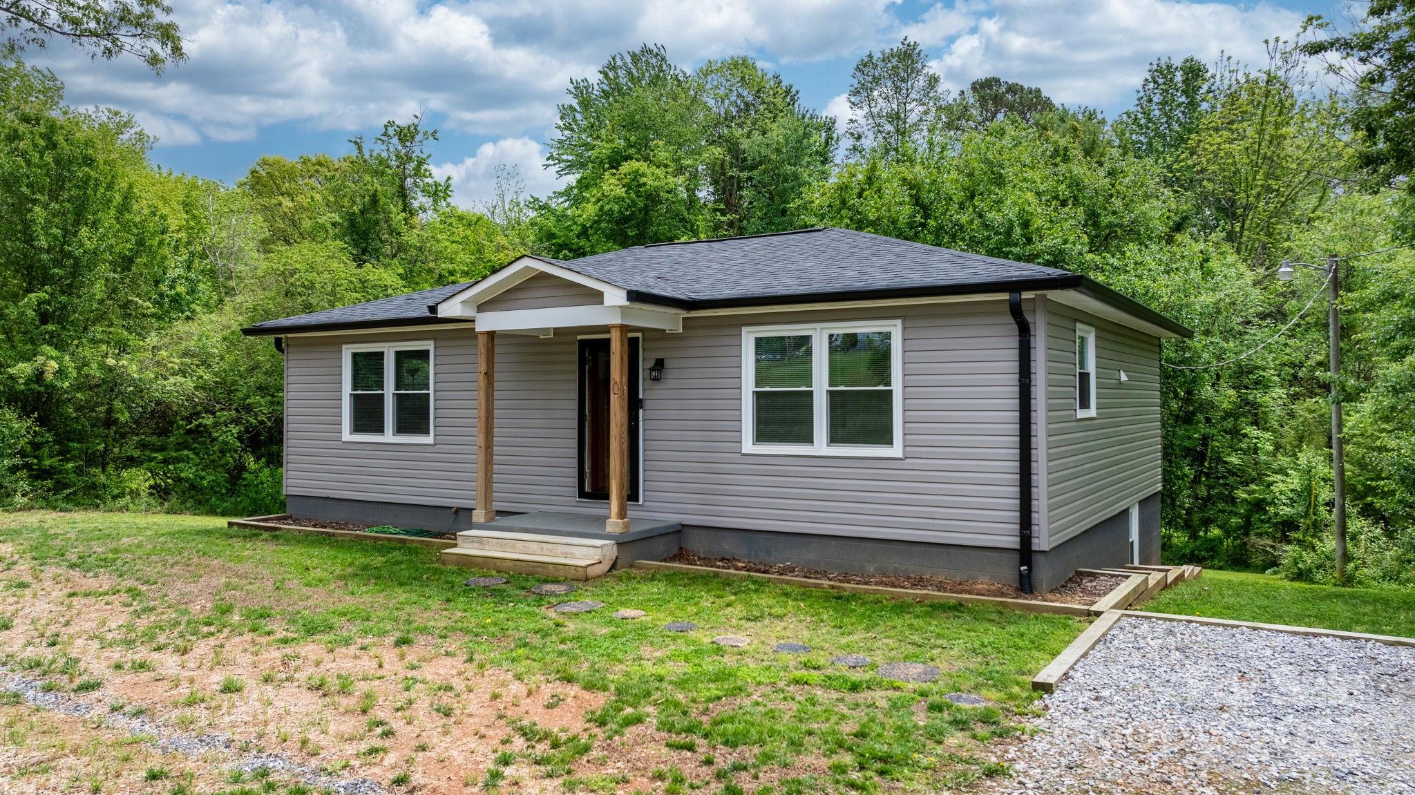 2473 Israel Chapel Road Connelly Springs, NC 28612 - Photo 1 of 37 a front view of a house with a garden