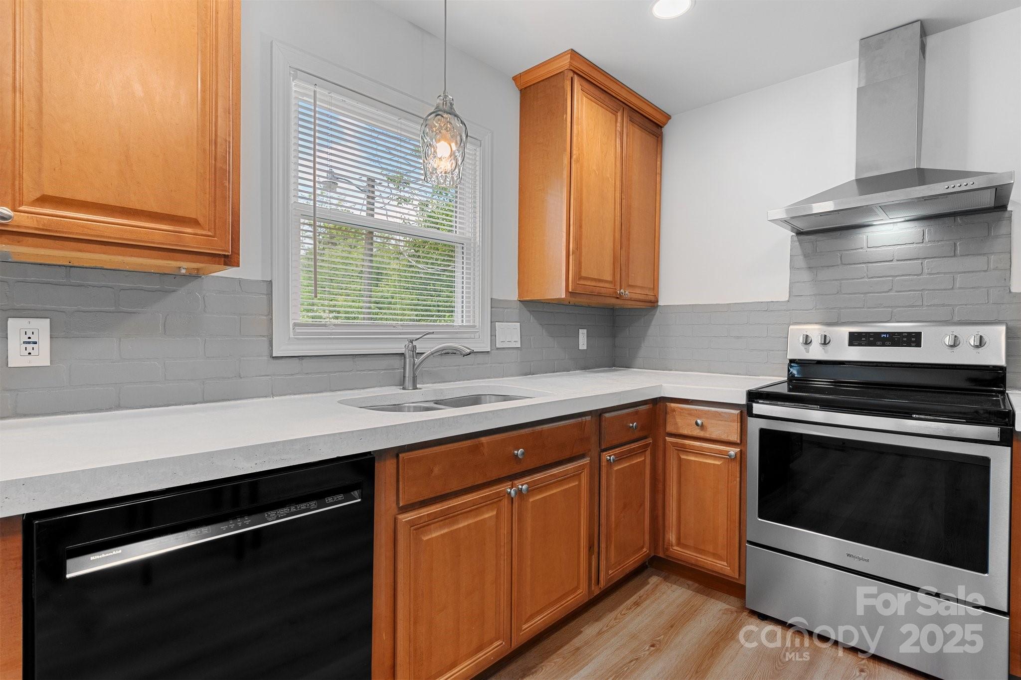 2473 Israel Chapel Road Connelly Springs, NC 28612 - Photo 11 of 37 a kitchen with a sink stove and cabinets