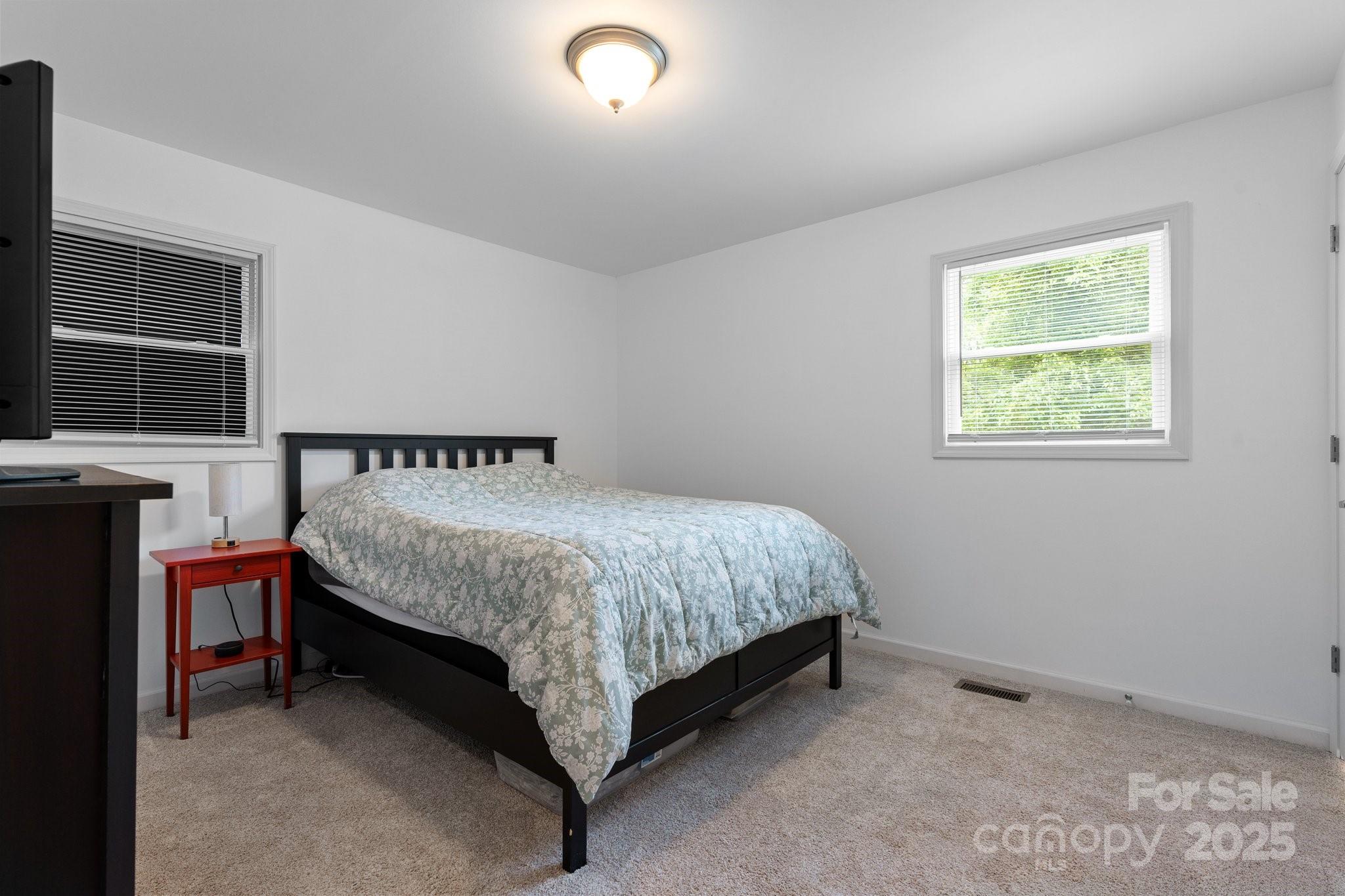 2473 Israel Chapel Road Connelly Springs, NC 28612 - Photo 16 of 37 a spacious bedroom with a bed and a window