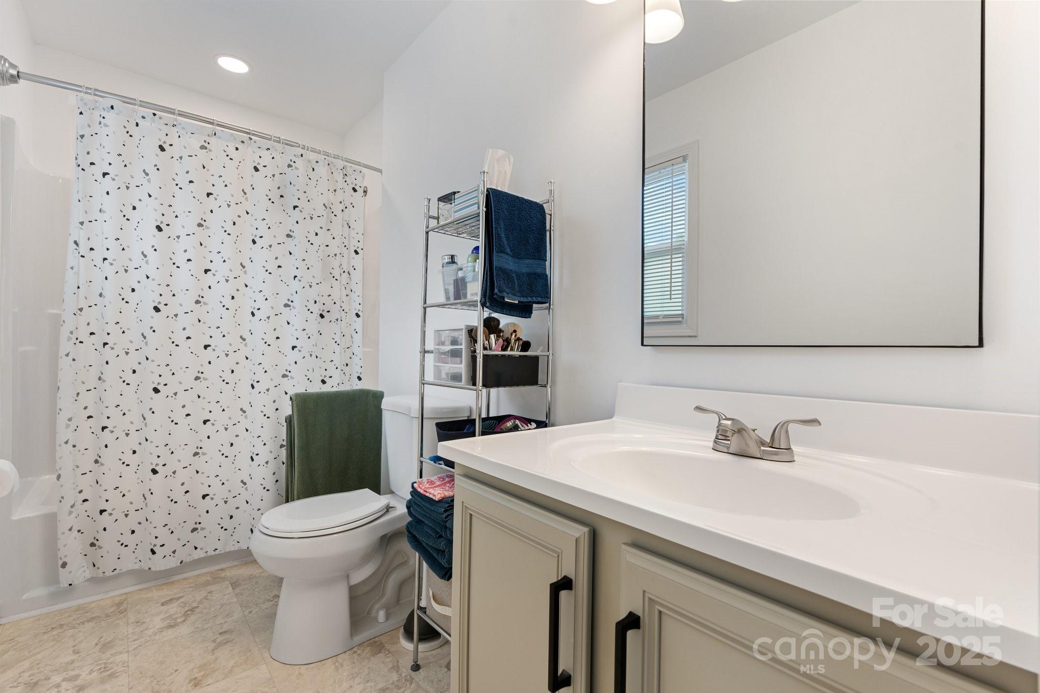 2473 Israel Chapel Road Connelly Springs, NC 28612 - Photo 18 of 37 a bathroom with a sink toilet and shower