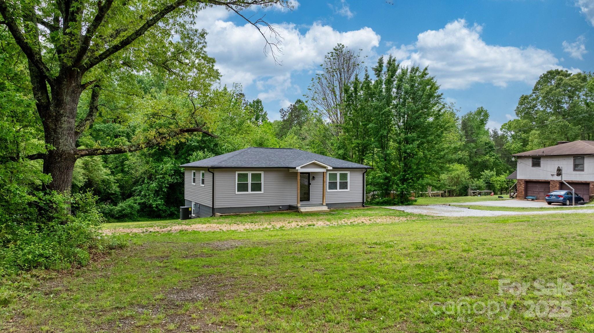 2473 Israel Chapel Road Connelly Springs, NC 28612 - Photo 19 of 37 a view of a house with a yard