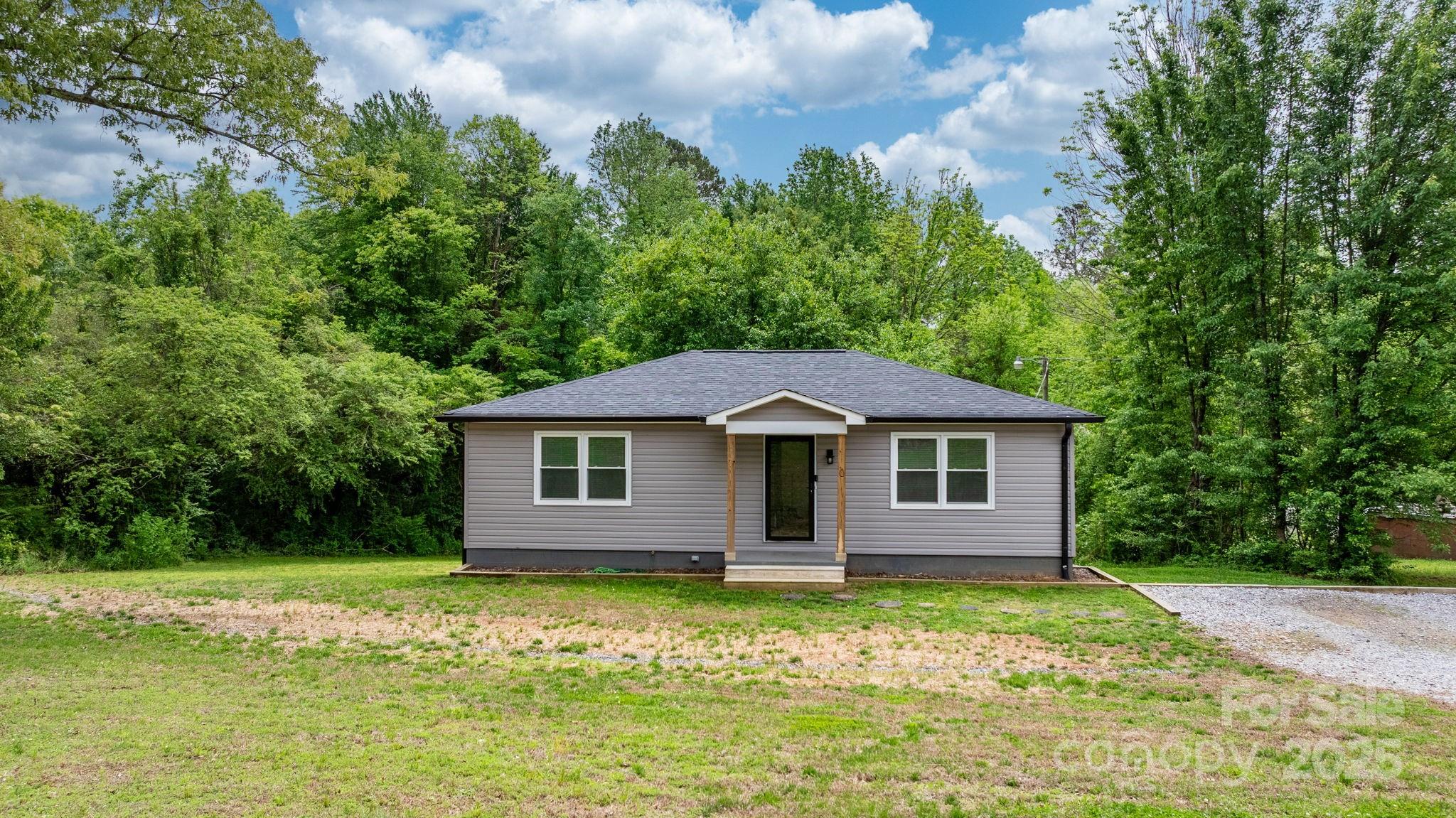 2473 Israel Chapel Road Connelly Springs, NC 28612 - Photo 20 of 37 a front view of a house with garden