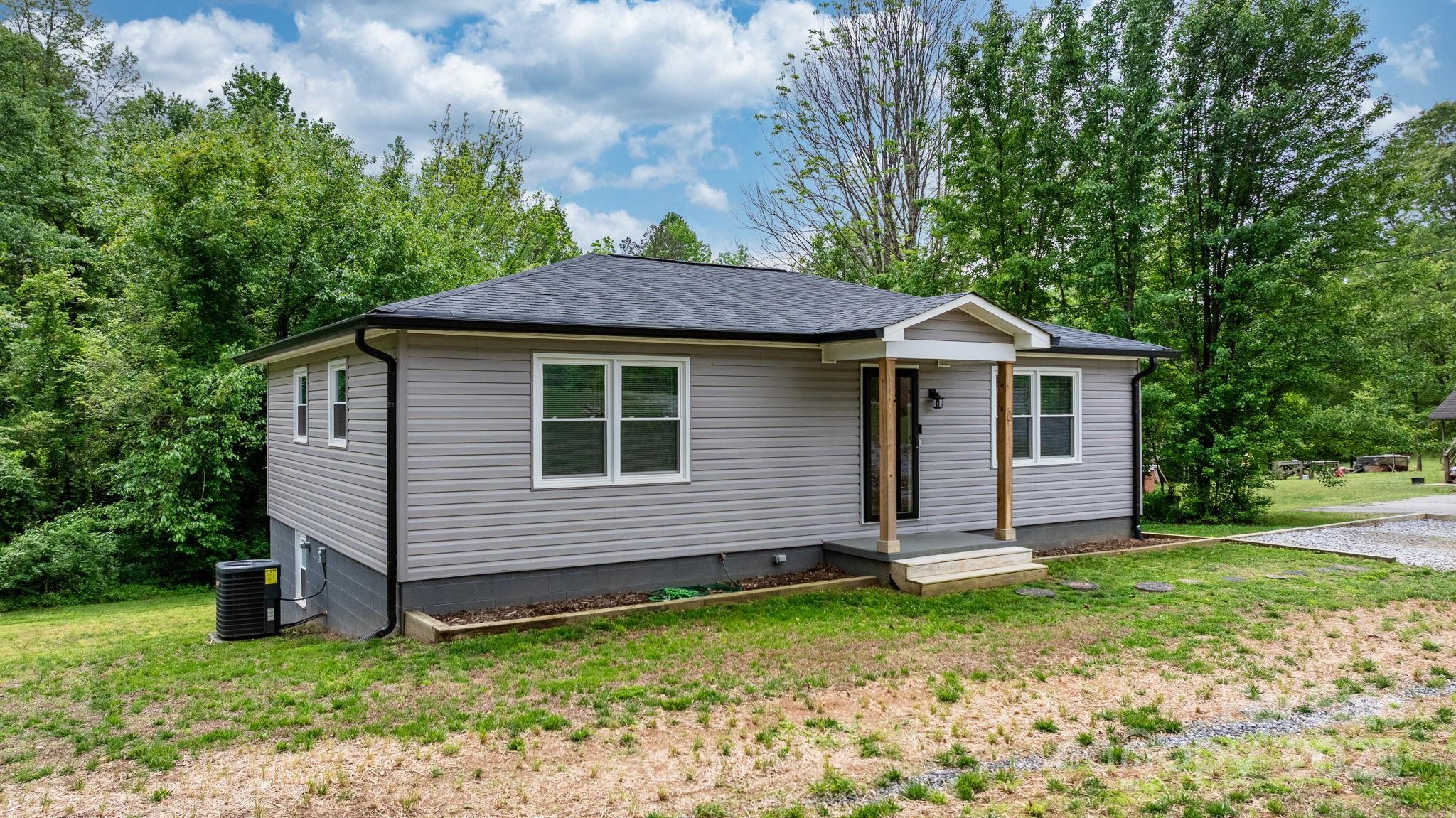 2473 Israel Chapel Road Connelly Springs, NC 28612 - Photo 22 of 37 a front view of a house with garden