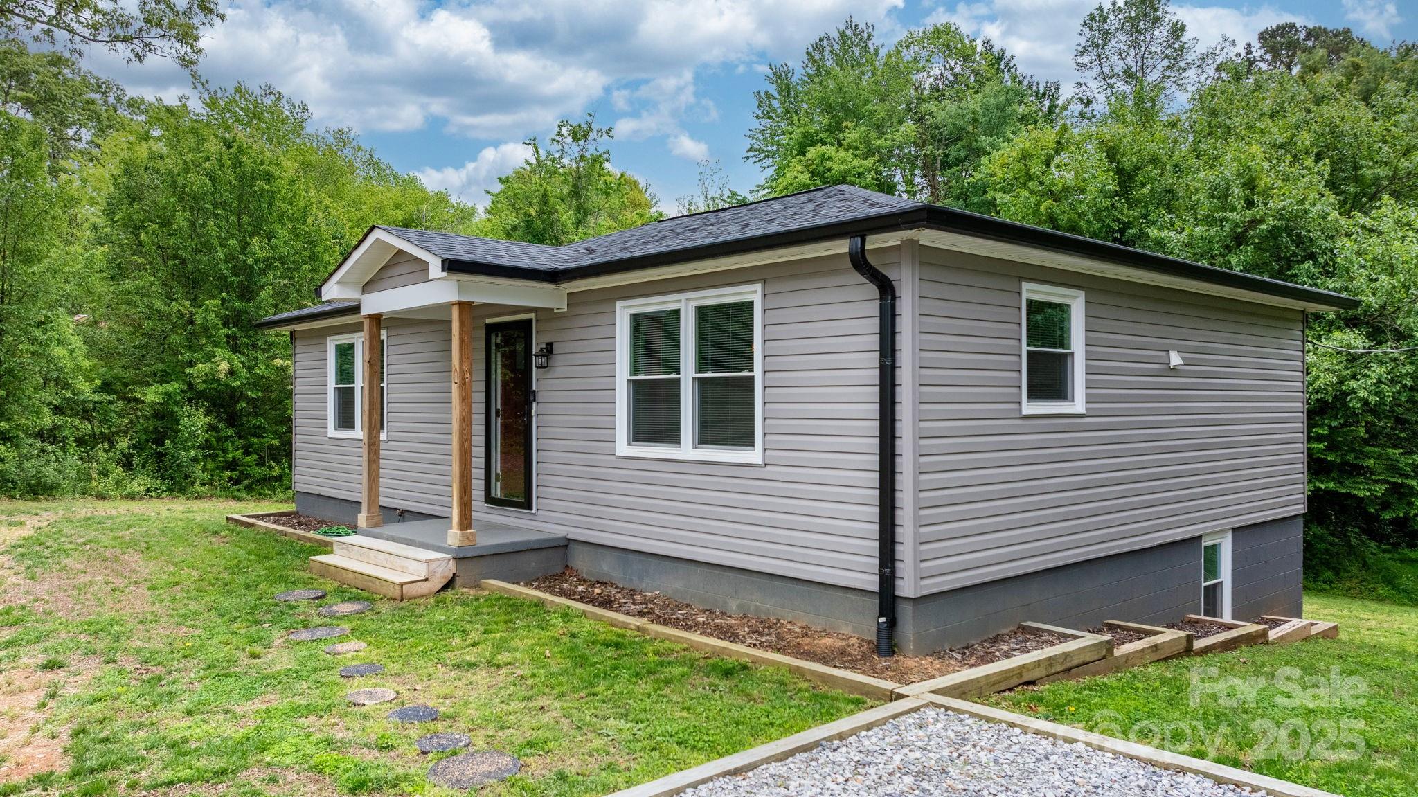 2473 Israel Chapel Road Connelly Springs, NC 28612 - Photo 23 of 37 a view of a house with a yard and garage