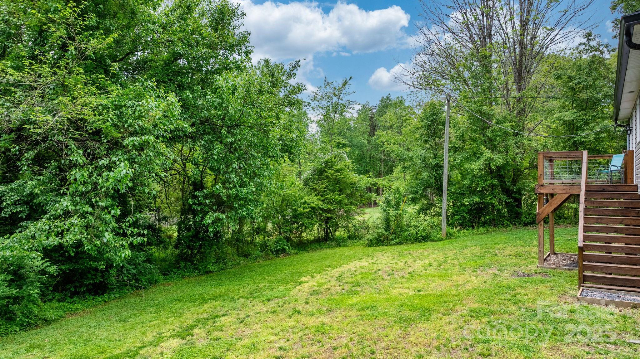 2473 Israel Chapel Road Connelly Springs, NC 28612 - Photo 25 of 37 a view of a backyard with a garden