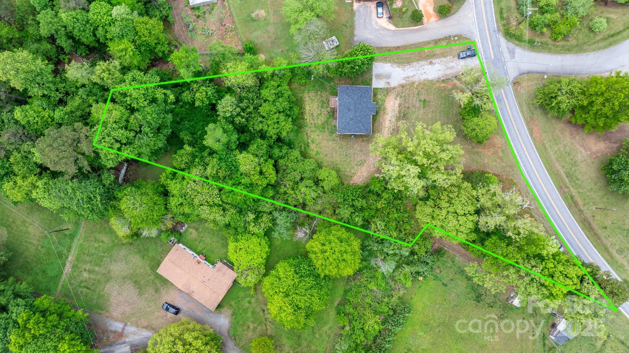 2473 Israel Chapel Road Connelly Springs, NC 28612 - Photo 3 of 37 an aerial view of a house with a yard