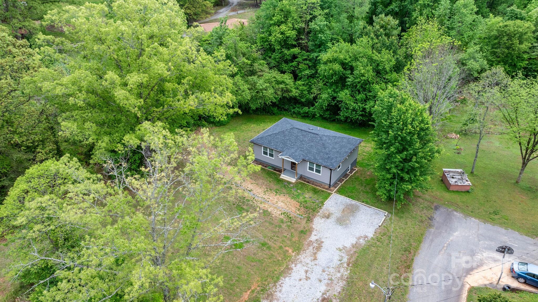 2473 Israel Chapel Road Connelly Springs, NC 28612 - Photo 32 of 37 a view of a house with a yard
