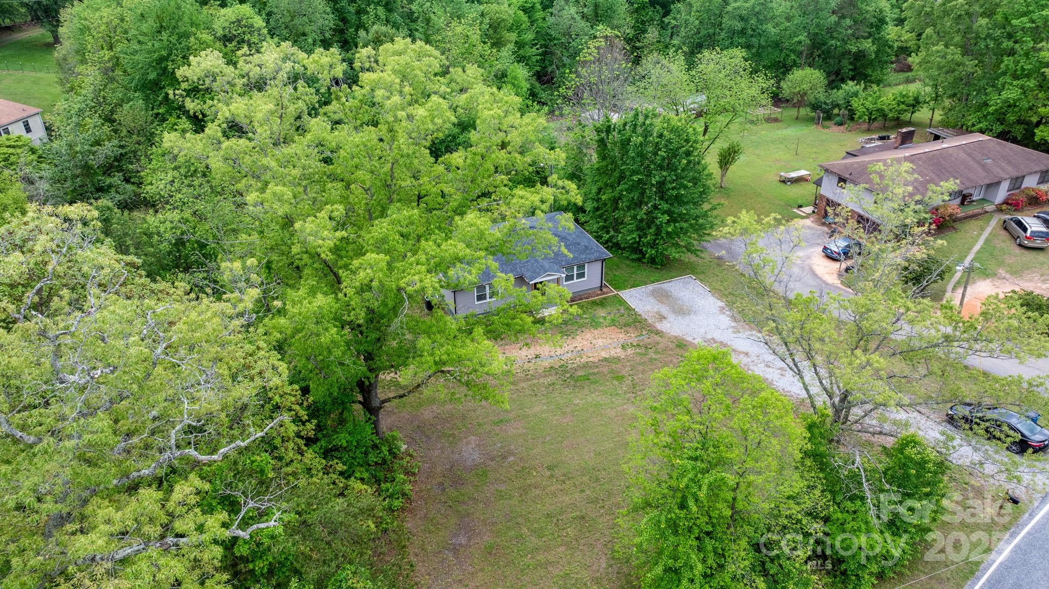 2473 Israel Chapel Road Connelly Springs, NC 28612 - Photo 33 of 37 an aerial view of a house with a yard