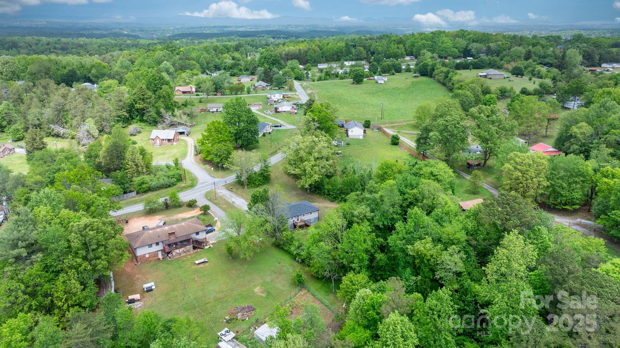 2473 Israel Chapel Road Connelly Springs, NC 28612 - Photo 34 of 37 a view of a garden with a lake view