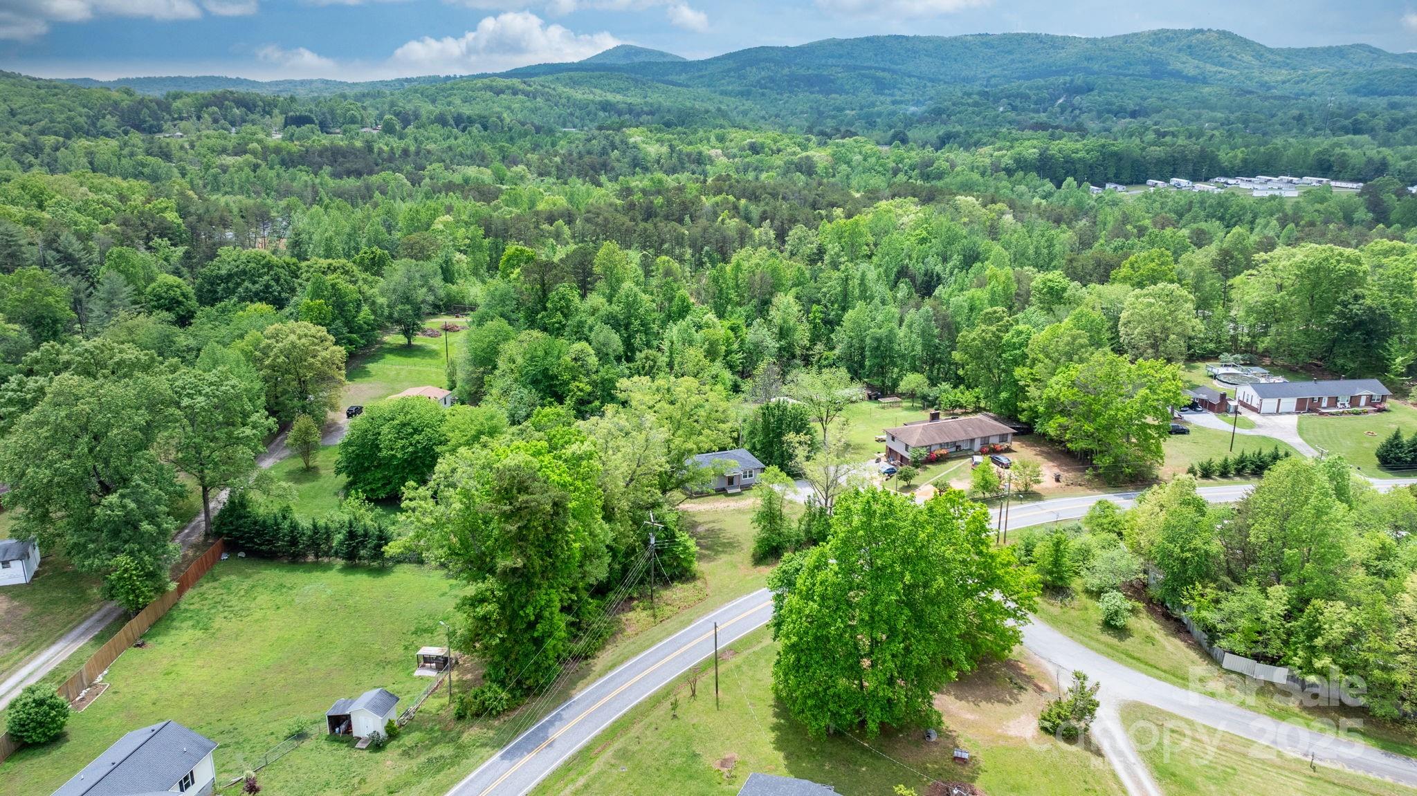 2473 Israel Chapel Road Connelly Springs, NC 28612 - Photo 36 of 37 an aerial view of residential house with outdoor space and trees all around