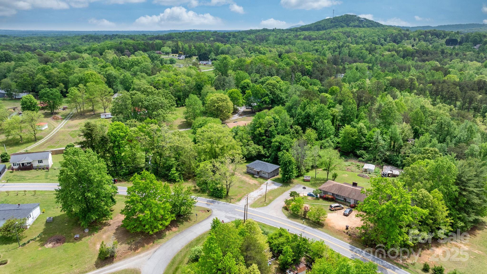 2473 Israel Chapel Road Connelly Springs, NC 28612 - Photo 37 of 37 an aerial view of a house with a yard