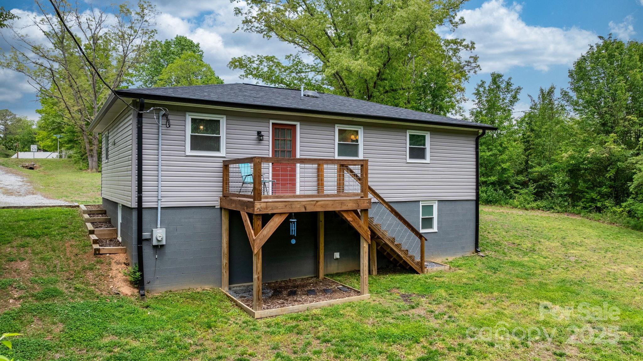 2473 Israel Chapel Road Connelly Springs, NC 28612 - Photo 4 of 37 a front view of a house with garden