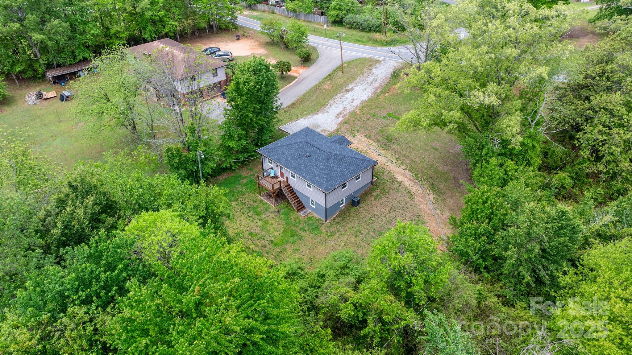 2473 Israel Chapel Road Connelly Springs, NC 28612 - Photo 5 of 37 an aerial view of a house with a garden