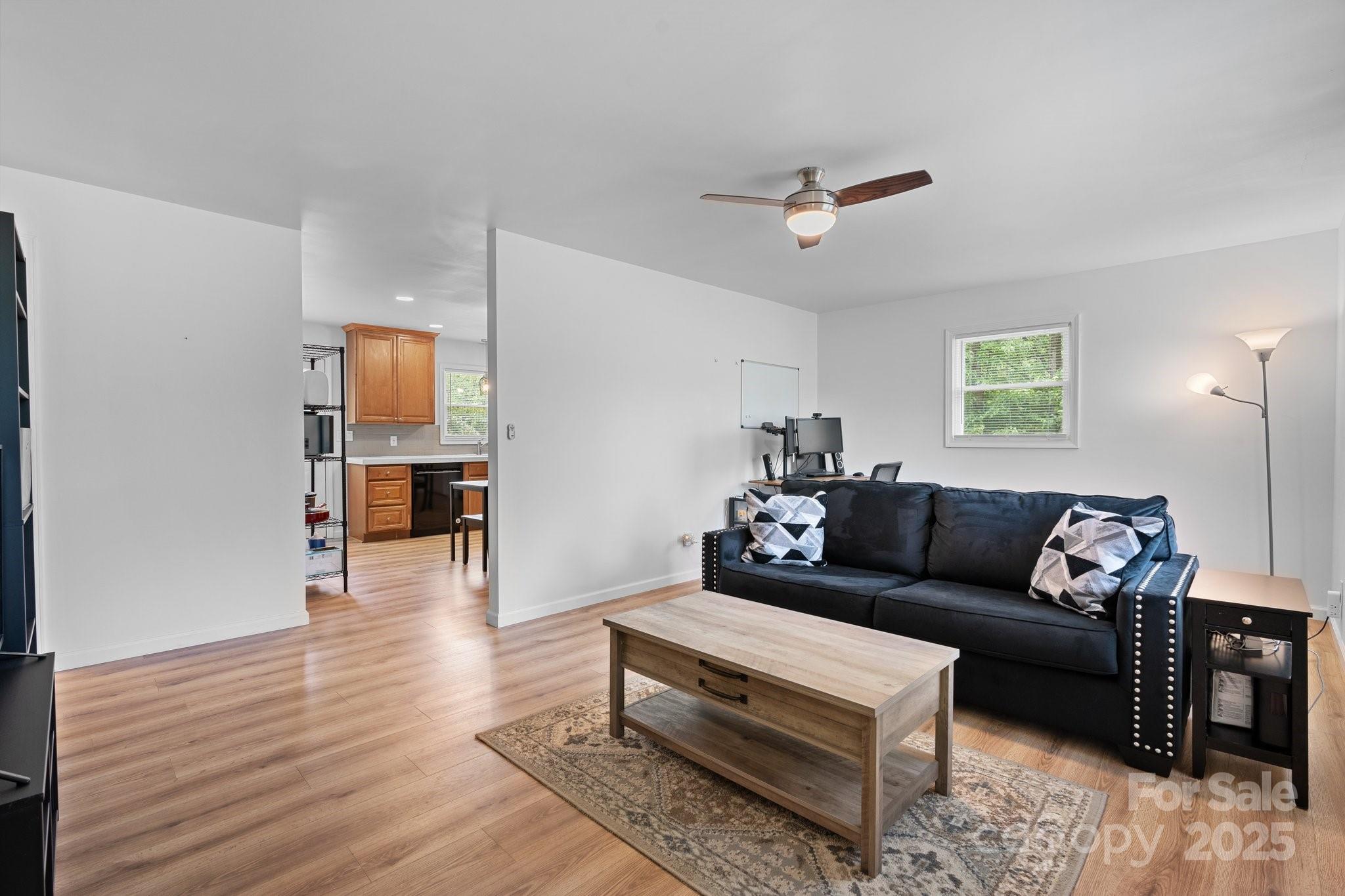 2473 Israel Chapel Road Connelly Springs, NC 28612 - Photo 7 of 37 a living room with furniture and a wooden floor