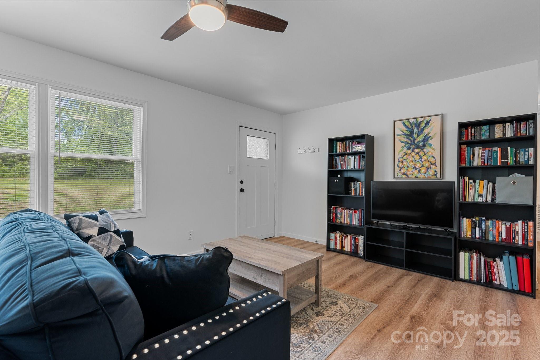 2473 Israel Chapel Road Connelly Springs, NC 28612 - Photo 8 of 37 a living room with furniture and a flat screen tv