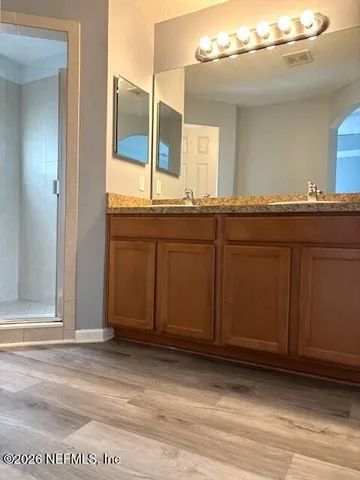 a bathroom with a sink and mirror