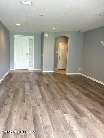 a view of an empty room and window