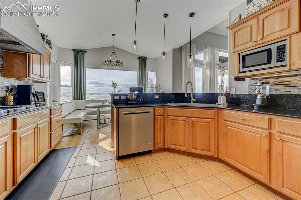 8640 Berridge Road Calhan, CO 80808 - Photo 11 of 50 a kitchen with stainless steel appliances granite countertop a sink and cabinets