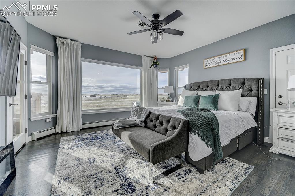 8640 Berridge Road Calhan, CO 80808 - Photo 17 of 50 a bedroom with a bed and wooden floor