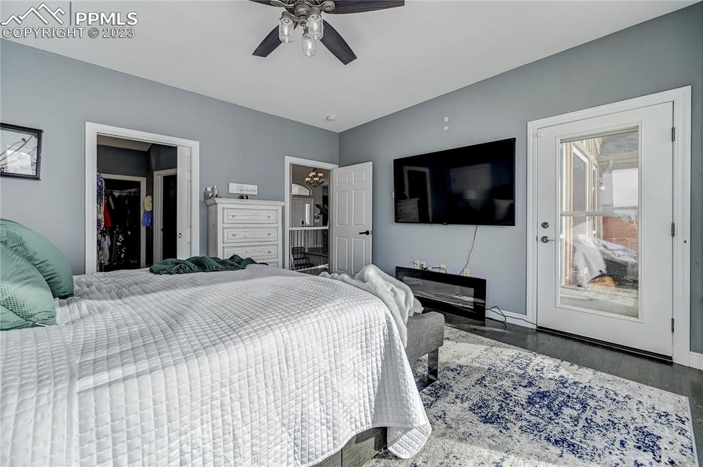 8640 Berridge Road Calhan, CO 80808 - Photo 19 of 50 a bedroom with a bed and a flat screen tv