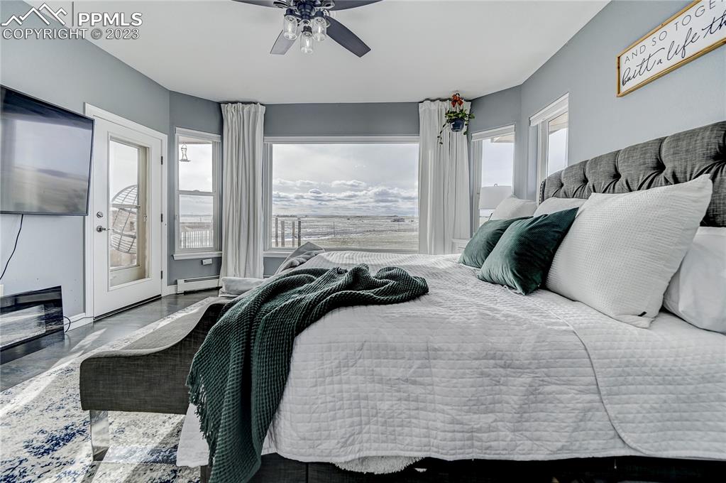 8640 Berridge Road Calhan, CO 80808 - Photo 20 of 50 a bedroom with a bed a window and a dresser