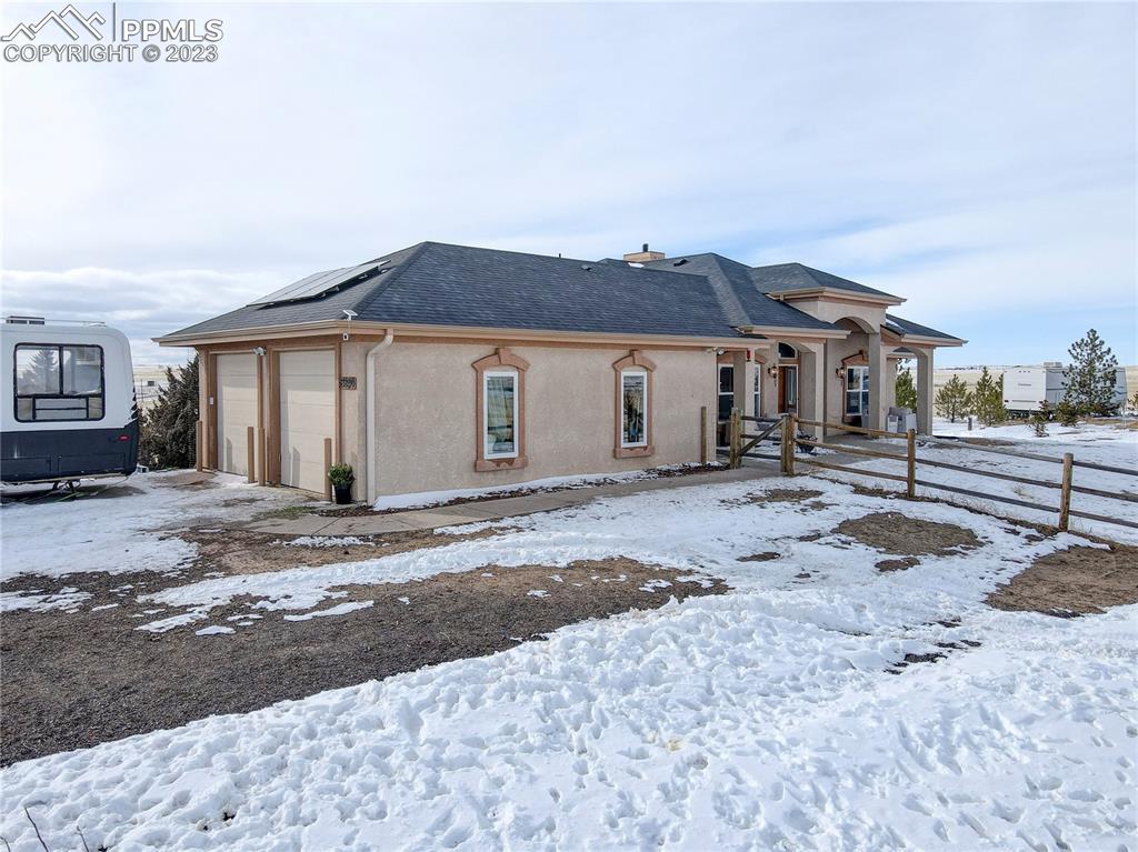 8640 Berridge Road Calhan, CO 80808 - Photo 2 of 50 a view of a house with a yard
