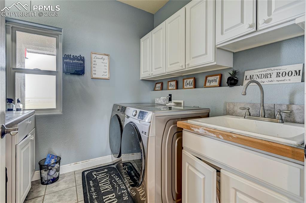 8640 Berridge Road Calhan, CO 80808 - Photo 25 of 50 a utility room with sink dryer and washer