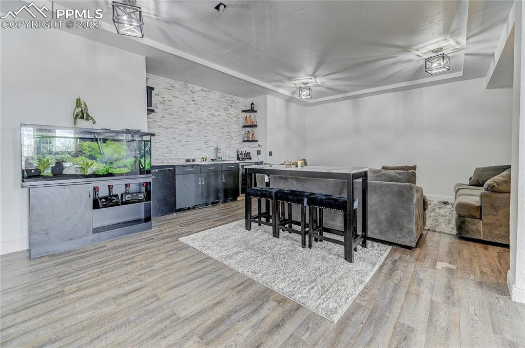 8640 Berridge Road Calhan, CO 80808 - Photo 30 of 50 a view of a dining room with furniture and wooden floor