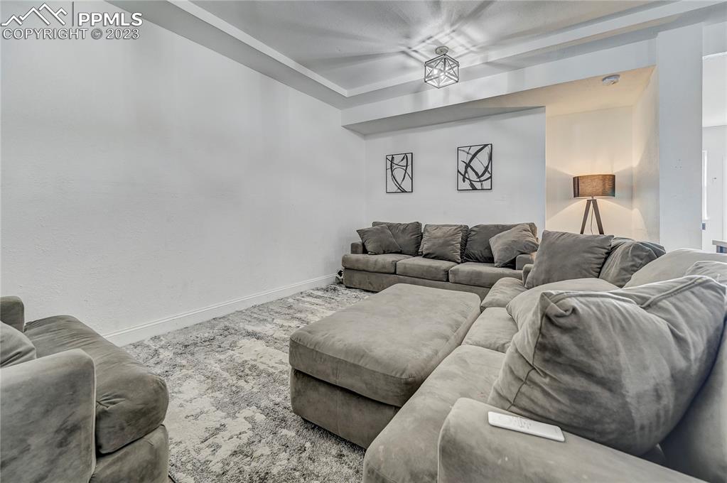 8640 Berridge Road Calhan, CO 80808 - Photo 32 of 50 a living room with furniture and a couch