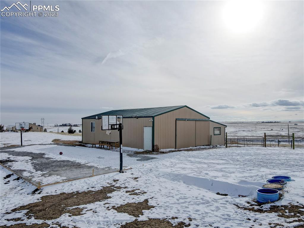 8640 Berridge Road Calhan, CO 80808 - Photo 44 of 50 a view of a house with a yard