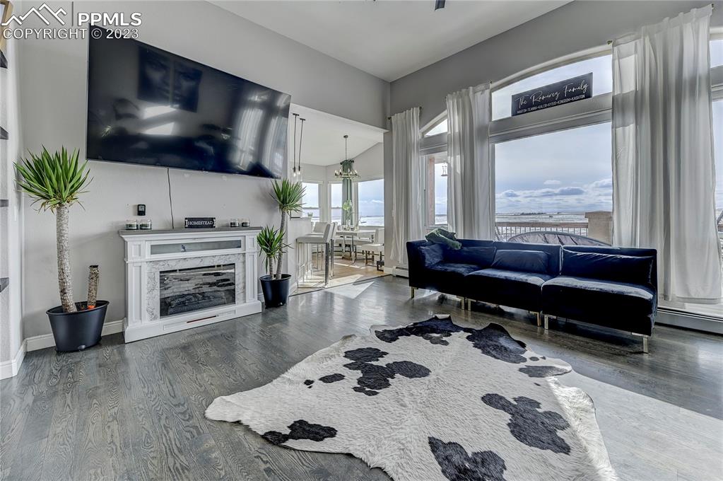 8640 Berridge Road Calhan, CO 80808 - Photo 5 of 50 a living room with furniture and a flat screen tv