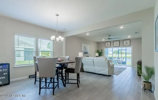 a bathroom with double vanity sinks and a mirror